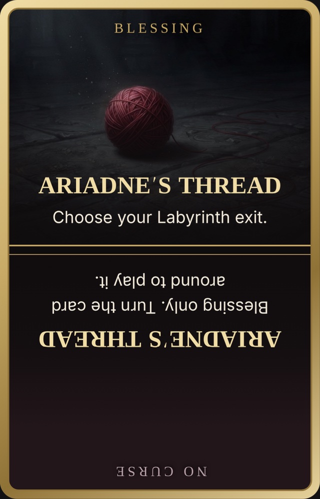 A ball of oxblood thread on black, one strand trailing, split like Ambrosia.